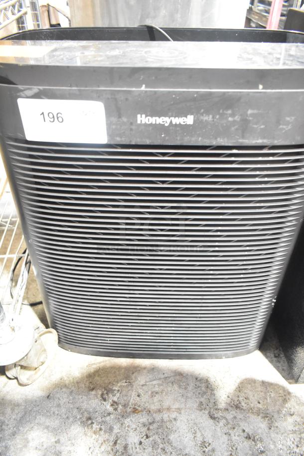 Honeywell HPA3300B air purifier, black, 120V, 1 phase. Slightly worn surface; item number 196 visible.