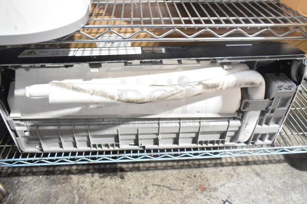 Della Split Type Room Air Conditioner, 115V, 100,000 BTU. Includes visible components and internal view on shelving.