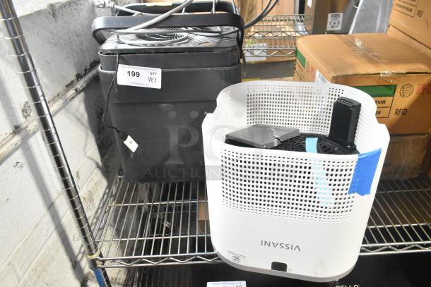 2 various fans, including Vissani and black model. Auction tag reads "199 x2." Located on metal shelf, fair condition.