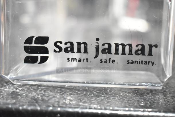 San Jamar logo on clear surface. Markings read "smart. safe. sanitary."