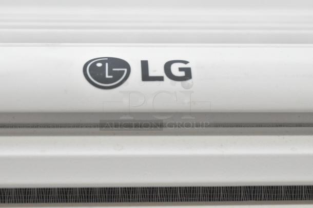 Two window mount air conditioning units, LG and Frigidaire, shown with LG branding. Good condition.