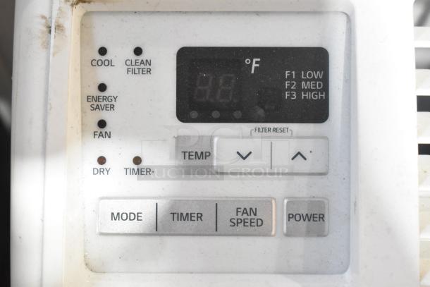 2 window mount air conditioning units, LG and Frigidaire, control panel with mode, timer, fan speed settings visible.
