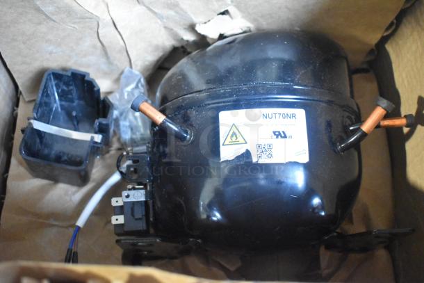 BRAND NEW SCRATCH AND DENT Cubigel NUT70NR compressor for Avantco appliances, model label visible.