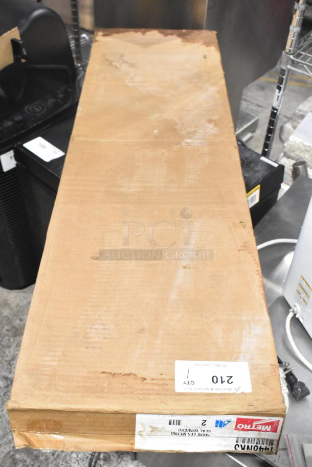 Box containing two Metro 1448NK3 Super Erecta Metroseal 3 wire shelves, 14"x48", brand new scratch and dent condition, labeled.