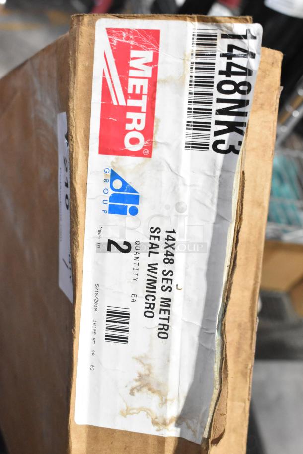 Box of 2 Metro 1448NK3 Super Erecta Metroseal 3 wire shelves, brand new with scratch and dent, 14" x 48", visible labels.