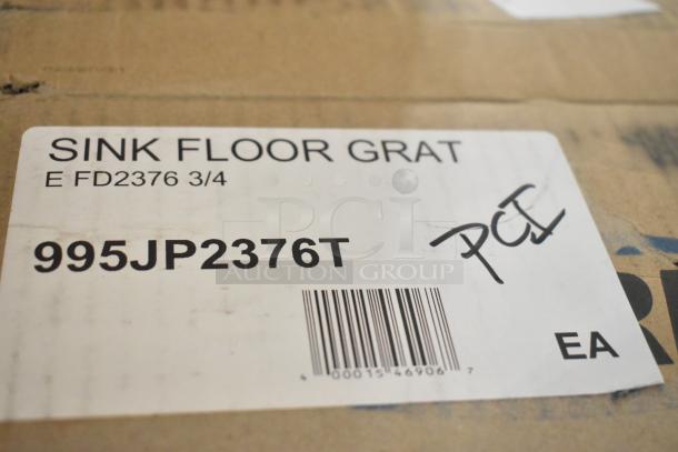 Zurn Elkay JP2376-T cast iron enameled 3/4 grate for FD2376 floor sinks, new with scratch and dent, barcode visible.