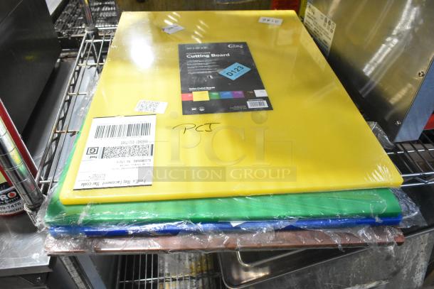 12 new scratch and dent Choice cutting boards, yellow, green, blue, 20"x15", 24"x18". Labeled with tags and barcodes.