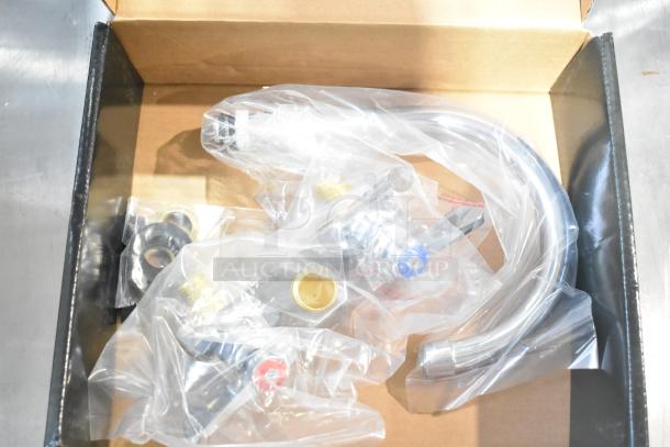 Vollrath JT2000 wall mount sink faucet in box, new, with 6" swivel gooseneck spout and 4" centers, in original packaging.