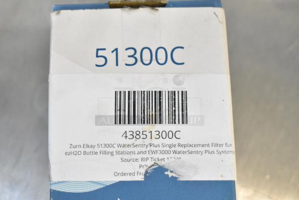 Close-up of Zurn Elkay 51300C WaterSentry Plus filter box, visible barcode, label indicating compatibility with ezH2O systems.