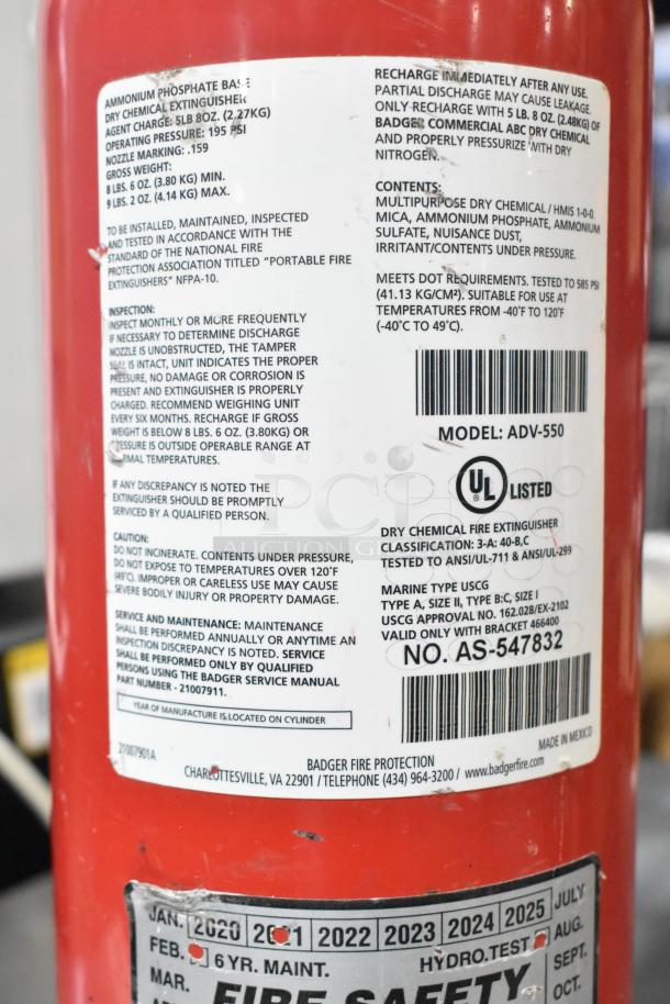 Red dry chemical fire extinguisher, Model ADV-550, labeled for commercial ABC use. UL listed, requires buyer pickup.