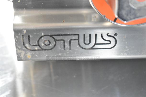 2023 Lotus PCT-66ET electric 4-burner range, stainless steel, visible wear, 220-240V, Lotus logo.