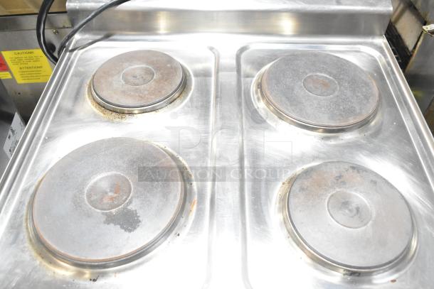 2023 Lotus PCT-66ET Commercial Electric 4 Burner Range, stainless steel, 220-240V, minor wear, visible caution labels.