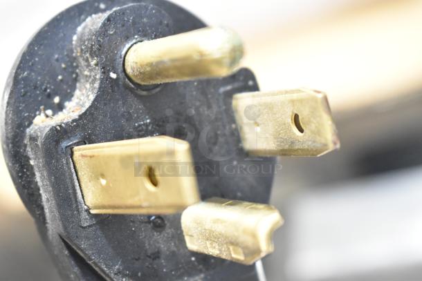 Close-up of a power plug for the 2023 Lotus PCT-66ET Commercial Electric 4 Burner Range, 220-240 Volts.