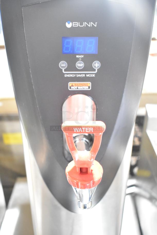 Brand new Bunn H5X hot water dispenser, 208V, 1 phase. Visible digital display, red spout, and hot water warning label.