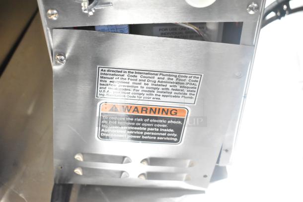 Bunn H5X hot water dispenser, 2025 model, stainless steel, 208V, 1 phase, scratch and dent condition. Warning label visible.