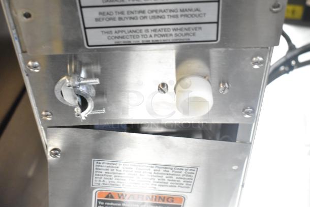 BRAND NEW 2025 Bunn H5X hot water dispenser, scratch and dent. 208 volts, 1 phase. Visible labels warn about operation.