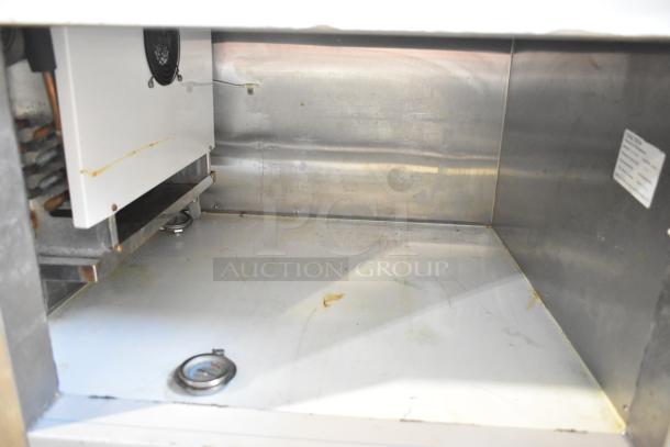 Cooltech Commercial Single Door Chef Base, 115 Volts, 1 Phase. Interior view showing stainless steel construction and some wear marks. Tag visible.