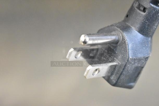 Close-up of a Vito XM fryer oil filter system plug, showing a three-prong design for 100-120 volts, 1 phase connection.