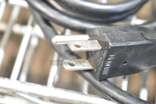 SM Commercial Countertop Espresso Bean Grinder power plug. 115 volts, 1 phase. Black cord indicates functionality.