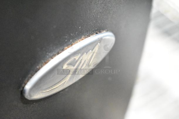 SM Commercial Countertop Espresso Bean Grinder, metal SM logo, runs on 115 Volts, 1 Phase.