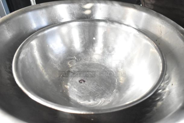 Set of two stainless steel bowls with visible wear. Includes 18 various items. Bid for bulk value.