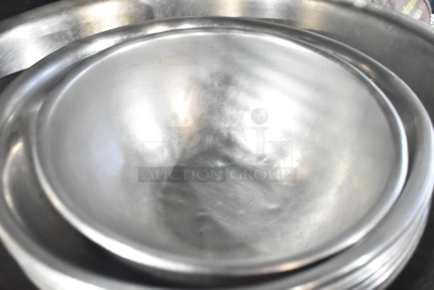 Set of metal bowls in good condition, shiny surface. Lot includes 18 mixed items for auction.