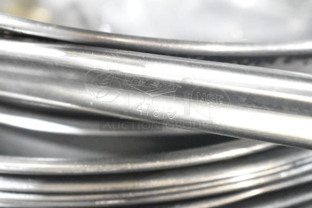 Alt text: Close-up of Vollrath metal bowls with NSF marking and number 47816, indicating quality and safety compliance.