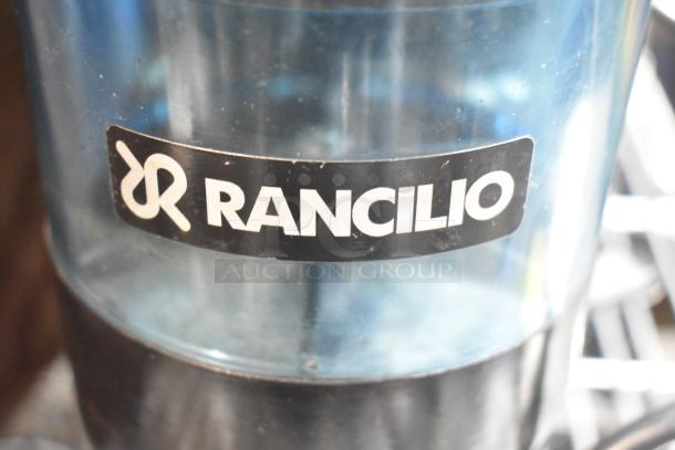 Rancilio Rocky Doser espresso grinder, 115V, used; features brand label on transparent bean hopper.