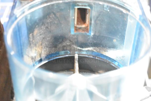 Rancilio Rocky Doser espresso grinder, 115V, countertop model, clear chamber, appears gently used, some wear visible.