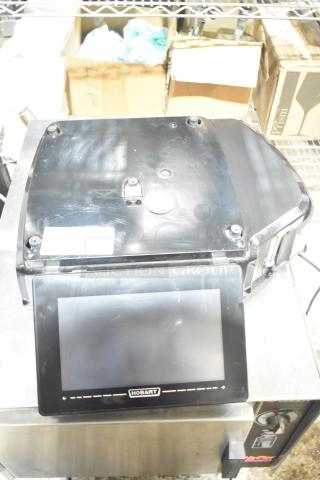 2024 Hobart HTi-7LH4W commercial countertop scale, black, touchscreen, 120/208-240 volts, 1 phase, marked with Hobart logo.