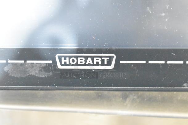 2024 Hobart HTi-7LH4W commercial countertop scale, black, visible Hobart logo, 120/208-240V, 1 Phase, excellent condition.