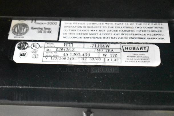 2024 Hobart HTi-7LH4W commercial countertop scale label, showing model, serial number, voltage, and certification marks.