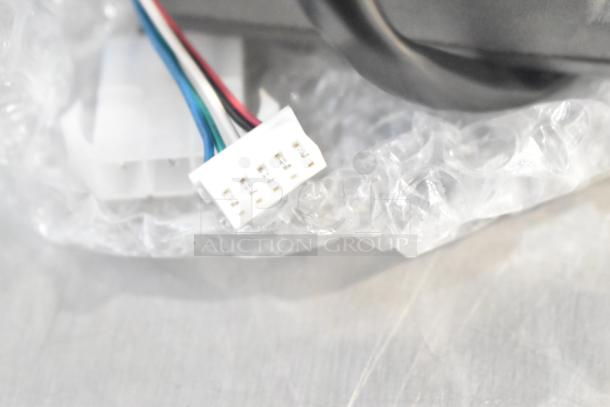 Royal Kincool FL57BLS01-24V-4000AD-01 Round Motor, new condition, multicolored wiring with connector, bubble wrap packaging.