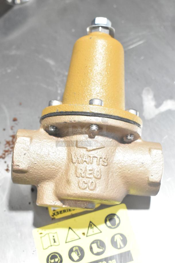 Watts Reg CO unit, industrial component, good condition, with metal bolts and embossed branding. Includes safety label.
