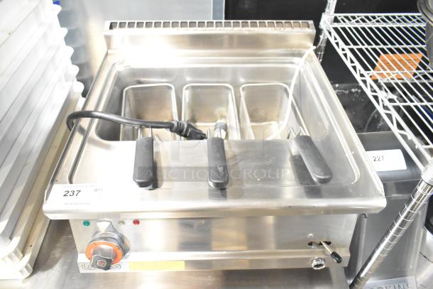 2022 Lotus CPT-66ET electric deep fat fryer with fry baskets, 380-415V, stainless steel, excellent condition, model visible.