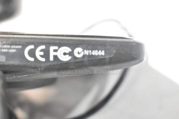 Close-up of a Garmin GPS unit showing CE, FCC, and compliance markings. Marking indicates model N14644.