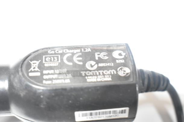 TomTom Go car charger 1.2A with CE, FCC, and GS certifications; model number 4N00.002.3, made in China.
