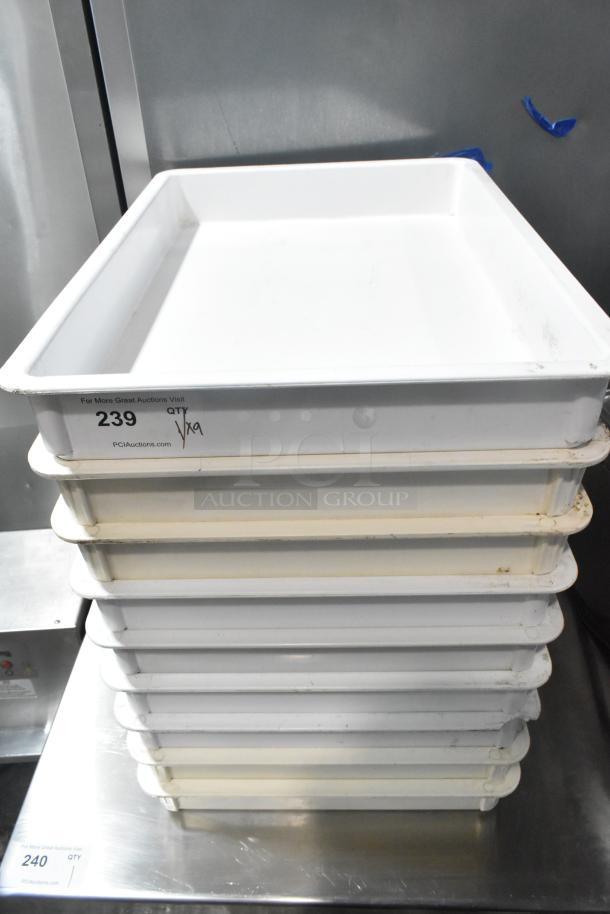 9 white poly dough bins stack, moderately used. Marked as QTY x9, item number 239 at PCIauctions.com. Suitable for kitchen use.