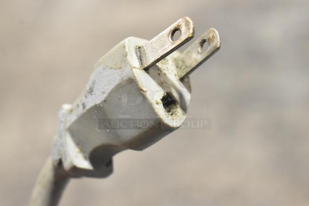 Close-up image of a used power plug from a Hobart 2912 Commercial Countertop Automatic Meat Slicer.