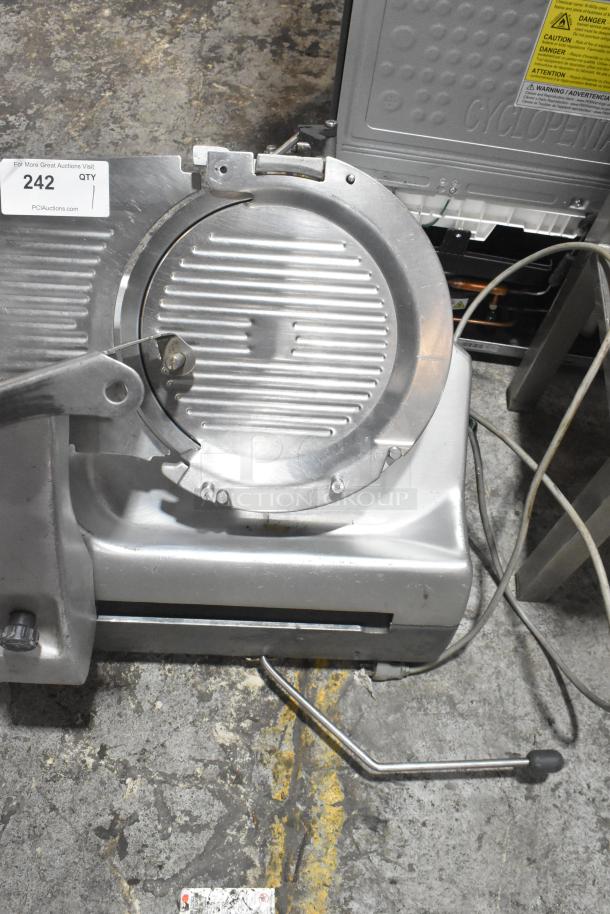 Hobart 2912 commercial automatic meat slicer, 115 volts, 1 phase, stainless steel, fair condition, auction tag visible.
