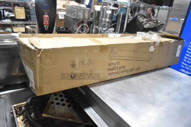 IN ORIGINAL BOX! CHCL04832HW LED Puff Light, 100-277 Volts. Box slightly damaged, unopened, with manufacturer markings.