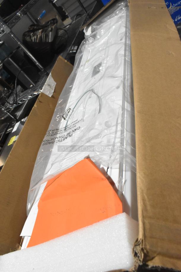 IN ORIGINAL BOX! CHCL04832HW LED Puff Light, new condition, 100-277 Volts, shown in packaging with installation guide.