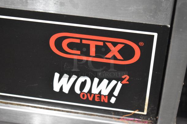 Middleby Marshall CTX DZ33I conveyor pizza oven logo. "WOW! Oven" branding visible on stainless steel surface.