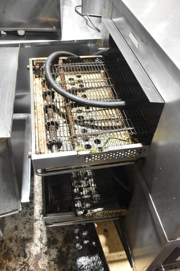 Two Middleby Marshall CTX DZ33I stainless steel conveyor pizza ovens, electric powered, on commercial casters.