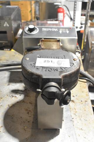 Sephra SEMANWB110V-01 countertop waffle maker, 110-120V, 1 phase, shows wear; includes control dial and warning label.