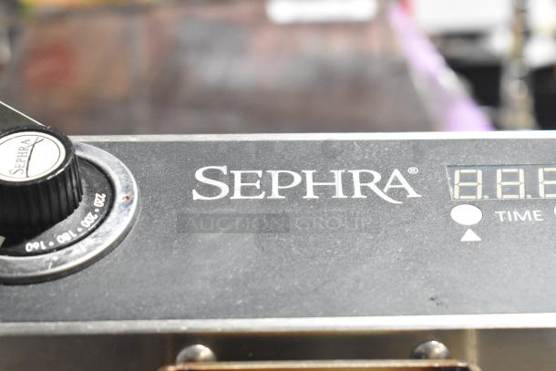 Sephra SEMANWB110V-01 countertop waffle maker, 110-120V, in good condition, features visible dial and digital display.