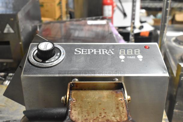 Sephra SEMANWB110V-01 countertop waffle maker, used condition. Features adjustable temperature dial, digital timer display.
