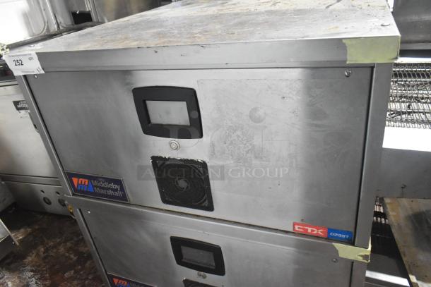 Middleby Marshall CTX DZ33T stainless steel conveyor pizza ovens on casters, 208V, used, visible Middleby Marshall logo.