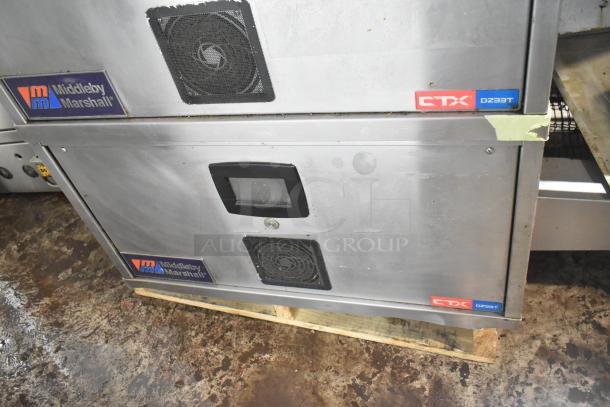 Middleby Marshall CTX DZ33T stainless steel conveyor pizza ovens on casters, 208V, 3/1 phase. Visible branding and model label.