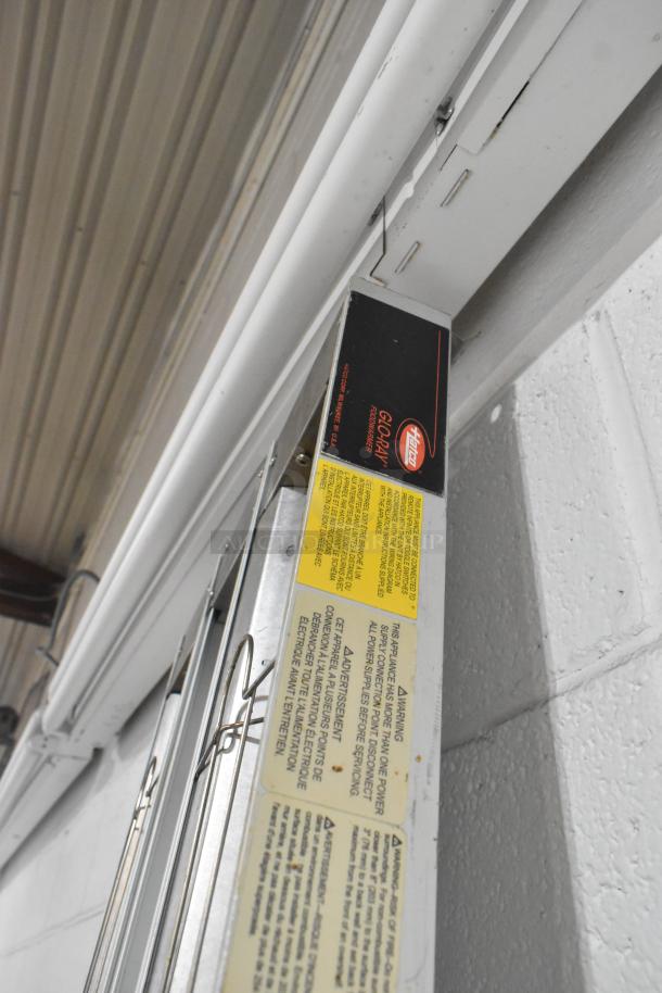 Hatco GRAH-96D commercial heat strip warmer, 208 volts, 1 phase. Metal construction, visible labels with safety and usage instructions.